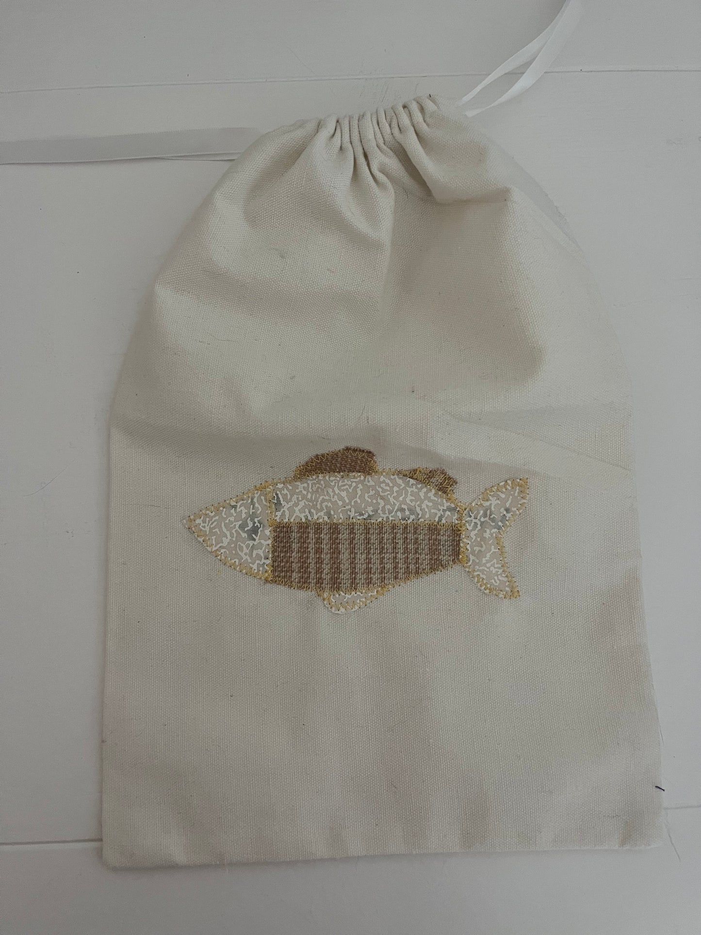 cream fish drawstring bag